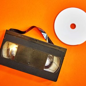 video tape adn DVD on oragen background